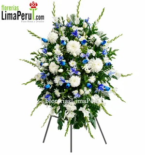 Arreglo fúnebre azul y blanco en trípode con rosas, iris y gladiolos